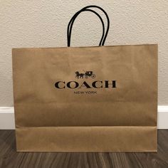 a brown paper bag sitting on top of a wooden floor