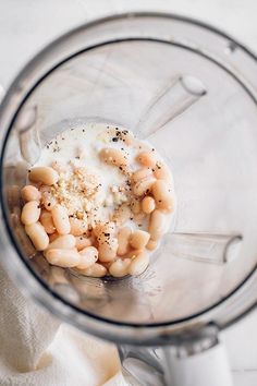 a blender filled with food on top of a table