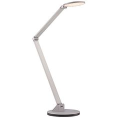 a white desk lamp with a dim light on the top and bottom part of it