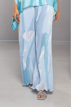 Blue pleated kaftan with abstract print. Comes with straight pant. - Aza Fashions Flowy Blue Maxi Bottoms, Blue Maxi-length Bottoms With Elastic Waistband, Blue Maxi Bottoms With Elastic Waistband, Chic Flowy Blue Bottoms, Blue Flowy Bottoms, Elegant Blue Vacation Sets, Chic Blue Maxi-length Bottoms, Elegant Blue Bottoms For Vacation, Blue Printed Beach Pants