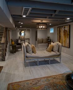 a living room filled with furniture and lots of pillows on top of it's couches