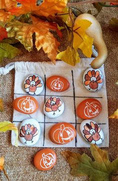 an orange and white checkered board with thanksgiving themed buttons