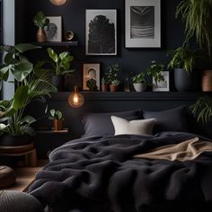 a bedroom with black walls, plants and pictures on the wall