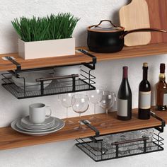 two wooden shelves with wine glasses, plates and bottles on them next to a potted plant