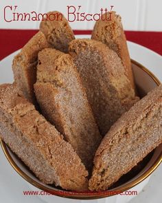 cinnamon biscuits in a white bowl on a red and white tablecloth