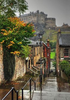 an image of a city street with buildings on the hill in the backgroud