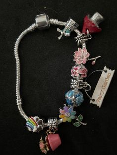 This is a handmade Fairy Garden Charm Bracelet! This is a unique, one of a kind charm bracelet! It will not be copied! Handmade Fairy, Charming Garden, Oct 31, Fairy Garden, Cuff Bracelets, Jewelry Bracelets, Etsy Accessories, Accessory Gift, Charm Bracelet