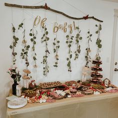 a table topped with lots of food next to a wall