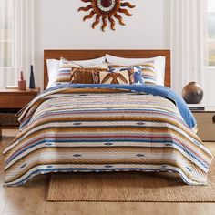 a bed in a room with a wooden headboard and rug on the floor next to it