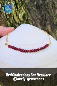 Materials used: The necklace is made with 3x4mm dark red rondelles of chalcedony assembled on a 18K gold plated brass chain 2.5mm, finished with lobster claw closure. The length of the necklace is 17'', let us know if you need 2" extension. #redchalcedony #barnecklace #goldenchain #gemstonebar #gemstonenecklace #giftforwife #giftforgirlfriend #rednecklace #redstonenecklace #redgems #redandgold #giftforgirlfriend #jewelrygift #chalcedonyjewelry #darkredbeaded #redcrystals #lovelygemstones Bar Necklace Layered, Red Stone Necklace, Red Crystal Necklace, Gemstone Bar Necklace, Bead Bar Necklace, Chalcedony Necklace, Red Bar, Silver Bar Necklace