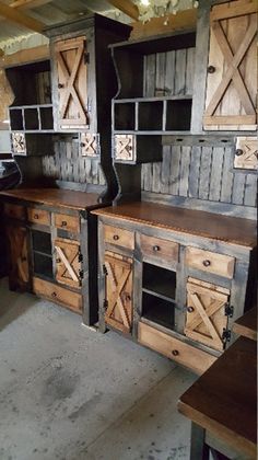 an old fashioned kitchen with wooden cabinets and drawers