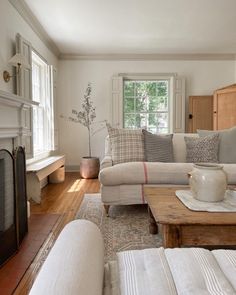 a living room filled with furniture and a fire place