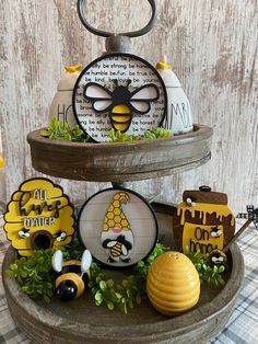 three tiered tray with bee themed items on it