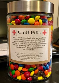 a jar filled with lots of colorful candy