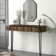 a wooden table with two drawers and a mirror on the wall next to a potted plant