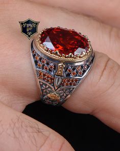 "Red Garnet Silver Ring, Ottoman Mens Ring, Handmade Ring, 925 Sterling Silver, Turkish Silver Ring, Fashion Ring, Best Gift ✦ Details ✦ * Material: 925 Sterling Silver * Gemstone: Garnet * Weight: 15.50 grams * Sides oxidized, decorated with Garnet stones and Micro zircon stones. * Stamp: 925 * Available sizes; 5 US to 16 US. Contact me if you need any other size! ✦ Shipping ✦ * Processing time: 1-3 business days. * This item ships from my Turkish workshop in Istanbul. * Add your phone number in address box for a smoother delivery. That makes courier personnel's job easier.  ✦ Packaging ✦ * Comes with a luxury gift box and a jewellery cleaning cloth and courtesy gift. ✦ Returns, Exchanges ✦ * Return option available for 30 days after the delivery. * The product has to be in the same shape Ring Fashion, Red Band, Garnet Stone, Mens Ring, Luxury Gift Box, Fashion Ring, Red Garnet, Ring Handmade, Cleaning Jewelry