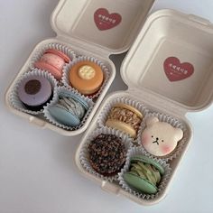 three plastic containers filled with different types of donuts