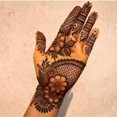 a henna tattoo on someone's hand