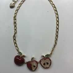 15-1/2" Gold Chain Inclusive Of 3-1/2" Of Design Consisting Of 3 Iridescent Red Apples, 1" In Width, With Green Rhinestone Leaves On The Outer Edges. One Apple Is Cut In Half With 2 Black Seeds On White Alabaster Surface, The Middle Apple Has 1/4 Missing Revealing 1 Black Seed, And The Third Apple Is Whole. Lobster Claw Closure, 3" Extender, And Betsey Heart. Gold Findings. Retail - $58. Nwt Snack Necklace, Apple Necklace, Pink Camera, Pumpkin Necklace, Cherry Necklace, Bunny Necklace, Red Apples, White Alabaster, Unicorn Necklace