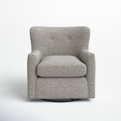 a gray chair sitting on top of a white floor