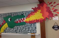 a bulletin board with a fire breathing dragon on it