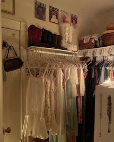 the closet is full of clothes and shoes