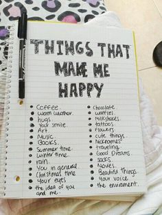 a notebook with things that make me happy written on it