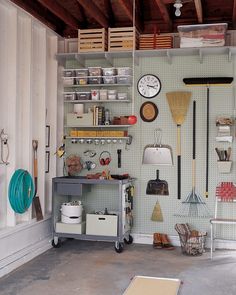 a garage filled with lots of tools and hanging utensils on the wall next to shelves