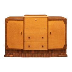 an art deco sideboard with two doors and drawers