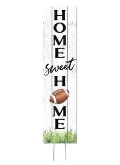 a wooden sign that says home sweet home with a football on it