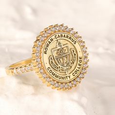 We creating this graduation college class ring you see using 925 sterling silver and 14k gold. It is the perfect accessory that will suit your shine or make it feel special. It will be a unique gift that will add meaning to your precious days such as graduations, birthdays, mother's days, wedding events. Diameter of the area to be customized: 12mm Click on this link for other signet rings: https://www.etsy.com/shop/daintypersonalizedco/?section_id=33650047 ♥ HOW TO ORDER ♥ Plase select your desi Gold Signet Ring With Halo Setting For Gift, Gold Signet Ring With Halo Setting As A Gift, Personalized Gold Rings For Commemoration, Gold Oval Halo Ring As Gift, Gold Cluster Ring With Halo Setting For Gift, Gold Halo Ring Gift, Gold Halo Ring For Gift, Gold Halo Ring As Gift, Gift Cluster Ring With Halo In Open Design