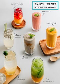 various types of drinks on wooden trays with price label for each drink in the middle