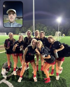 a group of young women standing on top of a soccer field