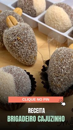 chocolate covered donuts with sprinkles in trays on wooden table top