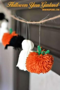 halloween yarn garlands hanging from the ceiling