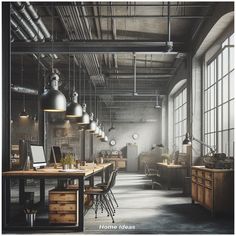 an industrial style office with large windows and desks