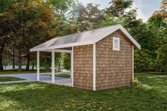 a small wooden shed sitting in the grass