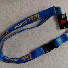 two lanyards with logos on them sitting on the floor