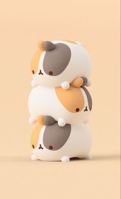 three small toy animals stacked on top of each other