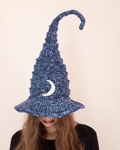 💫 Welcome to the magical realm of crochet craftsmanship, where every stitch tells a story and imagination comes alive! Presenting our unique Crochet Witch Hat, an enchanting piece of artistry designed to captivate the essence of Halloween in every thread. 🌙 Made purely from Microfiber Yarn, this Adult Witch Hat boasts a breathtaking design featuring a prominent half moon symbol, meticulously crocheted into the very heart of the hat. It's an emblem of mystical beauty, perfect for adding an extra layer of intrigue to your fantasy cosplay or Halloween ensemble. 🕸️ Unleashing the allure of the unknown, our crochet wizard hat personifies not just style, but personality. The handmade detailing reflects an inherent love for skilled artisanry, marking this witch hat an authentic product of pass Handmade Witchy Costume Hats And Headpieces, Handmade Adjustable Witchy Costume Hat, Handmade Themed Halloween Costume Hats And Headpieces, Whimsical Handmade Halloween Costume Hats And Headpieces, Handmade Halloween Hat One Size, Handmade Halloween Hat, One Size Fits Most, Handmade Halloween Hat One Size Fits Most, Handmade Mini Hats For Halloween Costume Party, Handmade Halloween Costume Hat