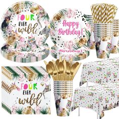 a birthday party set with pineapples, palm leaves and confetti plates