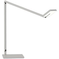 a white desk lamp sitting on top of a table