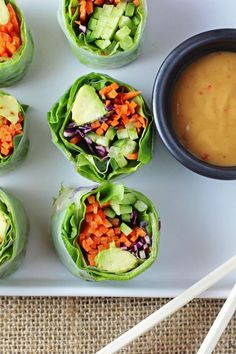 four lettuce wraps with carrots, celery and avocado