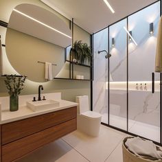 a bathroom with a large mirror, sink and bathtub next to a shower stall