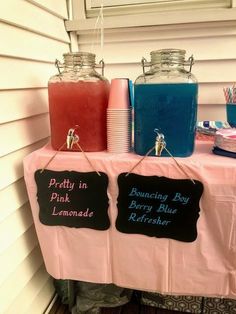 some drinks are sitting on top of a table with chalkboard signs that read pretty in pink and berry blue refreshments