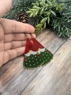 Festive beaded gnome earrings, in red and green classic Christmas colors. It's carefully crafted from premium Czech seedbeads, very lightweight and fun to wear. Handmade Beaded Earrings For Festive Occasions, Beaded Christmas Earrings Toocutebeads.com, Festive Handmade Beaded Earrings, Grinch Earrings Beaded, Beaded Elf Earrings, Christmas Tree Seed Bead Earrings, Earrings Handmade Boho, Beautiful Beaded Jewelry, Silver Star Earrings