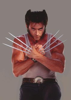 an autographed photo of wolverine from the tv series, with his arms crossed