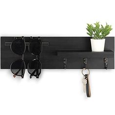 Return Policy Fast Delivery Trusted seller Key Holder for Wall, Decorative Entryway Shelf with Hooks Holds Keys, Dog Leash, Sunglasses – Key Hanger with 3 Hooks Organizes, Enhances Home Decor (15” x 4.5” x 2.6”) (Black) Product Description ORGANIZE WITH FLAIR using the beautiful Key Hanger for wall with shelf. Our key organizer has 3 key hooks, a shelf and a hanger to hold ID lanyards, sunglasses and dog leashes in 1 central locale. NATURAL PAULOWNIA WOOD adds an elegant touch to your entryway decor. Three widely-spaced hooks support bags, several sunglasses and other personal items on this 15”W x 4.5”H x 2.6”D wall key holder. ELEVATE YOUR WALL DECOR with a key wall holder finished in a stain that complements a living room, office, bedroom or entry hall. Each key organizer has knots and w Key Hanger Entryway, Entryway Shelf With Hooks, Key Holder Entryway, Creative Apartment, Apartment Necessities, Key And Letter Holder, Looking For Apartments, New Apartment Gift, Entryway Hooks