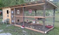 a small chicken coop with chickens in it