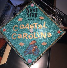 a decorated cap that says coastal carolina on it